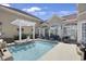 Beautiful pool area with bar stool seating, a pergola, and outdoor furniture at 837 Bluff View Dr., Myrtle Beach, SC 29579