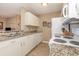 Efficient kitchen design includes white cabinets, granite countertops, and essential appliances at 8796 Cloister Dr. # B, Surfside Beach, SC 29575