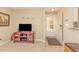 Cozy living room featuring neutral walls, beige carpet, and front door access at 8796 Cloister Dr. # B, Surfside Beach, SC 29575