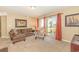 Inviting living area featuring cozy seating, a decorative painting, and natural light at 8796 Cloister Dr. # B, Surfside Beach, SC 29575