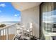 Ocean view balcony with two chairs, railing, and glass door at 9550 Shore Dr. # 226, Myrtle Beach, SC 29572