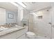 Bathroom featuring a granite vanity, updated fixtures, and a glass-enclosed walk-in shower for a fresh and modern experience at 9550 Shore Dr. # 226, Myrtle Beach, SC 29572