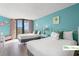 Bright bedroom showcasing two double beds, balcony access and coastal-themed decor for a relaxing beach retreat atmosphere at 9550 Shore Dr. # 226, Myrtle Beach, SC 29572