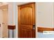 Image shows the entrance to the condo with wooden door, unit number and digital lock for secure and convenient access at 9550 Shore Dr. # 226, Myrtle Beach, SC 29572