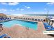 Outdoor pool with lounge seating overlooks the sandy beach and ocean at 9550 Shore Dr. # 226, Myrtle Beach, SC 29572