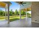 Covered patio featuring wood ceiling, ceiling fans, and views of the yard and pond at 985 Shipmaster Ave., Myrtle Beach, SC 29579