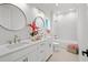 Bright bathroom featuring double vanity, updated fixtures and tile floors at 985 Shipmaster Ave., Myrtle Beach, SC 29579