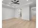 Spacious empty bedroom with light wood floors and ensuite bathroom at 985 Shipmaster Ave., Myrtle Beach, SC 29579