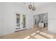Open entryway with hardwood floors, modern light fixture and an open floor plan at 985 Shipmaster Ave., Myrtle Beach, SC 29579