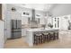 Spacious kitchen featuring a central island with seating, stainless steel appliances, and stylish decorative elements at 985 Shipmaster Ave., Myrtle Beach, SC 29579