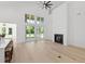 Open concept space with fireplace, large windows and sliding doors providing natural light at 985 Shipmaster Ave., Myrtle Beach, SC 29579