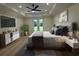 Bright main bedroom with white walls, tray ceiling, and access to backyard at 985 Shipmaster Ave., Myrtle Beach, SC 29579
