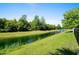 The backyard's beautiful pond and mature trees offer privacy and serene views at 985 Shipmaster Ave., Myrtle Beach, SC 29579