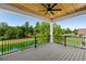 Covered porch with ceiling fan offering beautiful views of the water and surrounding trees at 985 Shipmaster Ave., Myrtle Beach, SC 29579