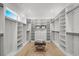Spacious walk-in closet with custom shelving, drawers, and a stylish bench at 985 Shipmaster Ave., Myrtle Beach, SC 29579