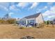 Backyard of home showcasing large yard and patio at 1004 Whooping Crane Dr., Conway, SC 29526