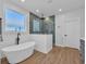 Elegant bathroom featuring a freestanding tub, a separate glass shower, and recessed lighting at 1004 Whooping Crane Dr., Conway, SC 29526