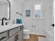 Clean bathroom featuring a gray vanity, modern fixtures, and tile flooring at 1004 Whooping Crane Dr., Conway, SC 29526