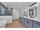 Modern bathroom featuring double sinks, gray tile and a separate shower at 1004 Whooping Crane Dr., Conway, SC 29526