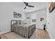Bright bedroom featuring a queen bed, ceiling fan, and lots of natural light at 1004 Whooping Crane Dr., Conway, SC 29526