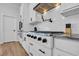 Close up on the professional range and stainless vent hood in this modern kitchen at 1004 Whooping Crane Dr., Conway, SC 29526