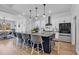 Bright and modern kitchen with a large island, white cabinets, stainless steel appliances, and counter seating at 1004 Whooping Crane Dr., Conway, SC 29526
