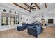 Open-concept living room with a view into the modern kitchen featuring a large island, dining area, and comfortable seating at 1004 Whooping Crane Dr., Conway, SC 29526