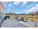 Outdoor patio with stone pavers, comfortable seating, and a view of the grassy backyard at 1004 Whooping Crane Dr., Conway, SC 29526