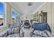 Bright sun room featuring large windows and furniture for lounging at 1004 Whooping Crane Dr., Conway, SC 29526