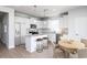 Well-lit kitchen with an island, stainless steel appliances, and a dining area with seating at 1005 Laconic Dr., Myrtle Beach, SC 29588