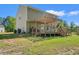 Backyard featuring a wooden deck with pergola and wooden railing and view of the home at 101 Winding Path Dr., Loris, SC 29569