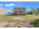 Backyard featuring a wooden deck with pergola and wooden railing and view of the home at 101 Winding Path Dr., Loris, SC 29569