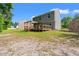 Backyard featuring a wooden deck with pergola and wooden railing and view of the home at 101 Winding Path Dr., Loris, SC 29569