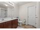 Bathroom with double sink vanity, tiled floors, and a large mirror at 101 Winding Path Dr., Loris, SC 29569