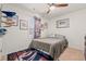 Bedroom with ceiling fan, carpeted floors, window and cowboy themed decor at 101 Winding Path Dr., Loris, SC 29569