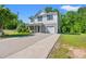 Two-story home with a one-car garage and beautifully manicured landscaping at 101 Winding Path Dr., Loris, SC 29569