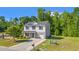 Charming two-story home with attached garage, nicely landscaped front yard, and a paved driveway at 101 Winding Path Dr., Loris, SC 29569