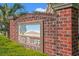 Brick sign at Red Bluff Village entrance with beautiful artwork at 101 Winding Path Dr., Loris, SC 29569