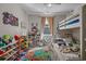 Bright bedroom with a bunk bed, ceiling fan, and plenty of space for play and storage at 1011 Maxwell Dr., Little River, SC 29566