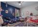 bedroom featuring a playful blue accent wall, lots of toys, and plenty of natural light at 1011 Maxwell Dr., Little River, SC 29566