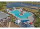 Stunning aerial shot of a resort-style community pool with ample seating and recreational spaces at 1011 Maxwell Dr., Little River, SC 29566