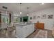 Modern kitchen with an island, granite countertops, and stainless steel appliances at 1011 Maxwell Dr., Little River, SC 29566
