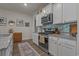 Bright kitchen features granite countertops, stainless steel appliances, and ample white cabinetry at 1011 Maxwell Dr., Little River, SC 29566