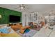 Cozy living room with a large TV, decorative wall, and modern furnishings at 1011 Maxwell Dr., Little River, SC 29566