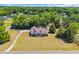 Expansive aerial view of home showcasing its manicured lawn, mature trees, and proximity to the surrounding neighborhood at 1014 Academy Dr., Conway, SC 29526