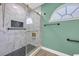A modern bathroom featuring a frameless glass shower with marble-style tiling, and black hardware at 1014 Academy Dr., Conway, SC 29526