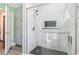 A bathroom with a glass shower featuring stylish tile, a rainfall shower head, and great lighting at 1014 Academy Dr., Conway, SC 29526