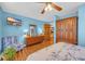 This bedroom boasts hardwood floors, a ceiling fan, and furnishings at 1014 Academy Dr., Conway, SC 29526