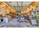 Interior of garage used as workshop, with lawnmower, shelves, tools, heater and boxes at 1014 Academy Dr., Conway, SC 29526