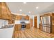 Well-lit kitchen featuring stainless steel appliances, wooden cabinets, ample counter space, and modern flooring at 1014 Academy Dr., Conway, SC 29526